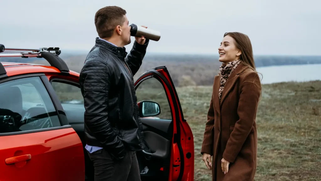 Talking next to a car