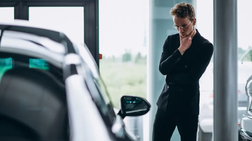 Man thinking about purchasing car