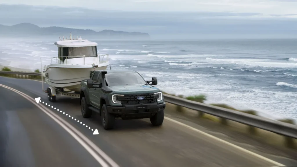 a ford pickup truck towing a boat