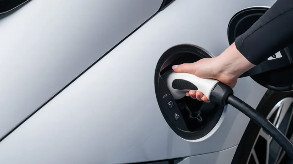 person plugging in charging adaptor in hyundai ioniq 6 australia