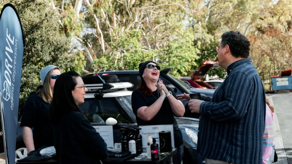 People talking in a Drive Against Depression event