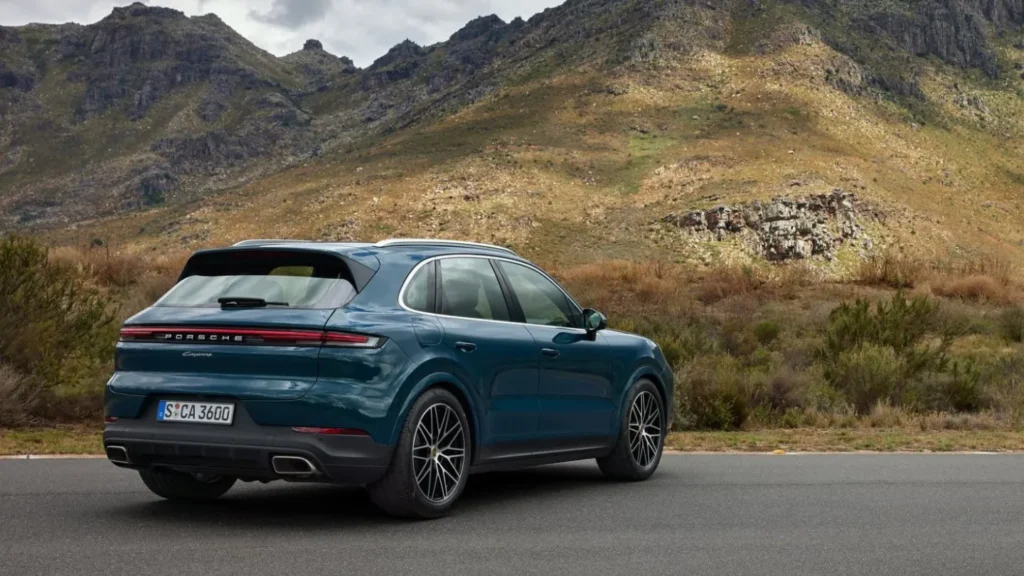 Porsche Cayenne overseeing a mountain