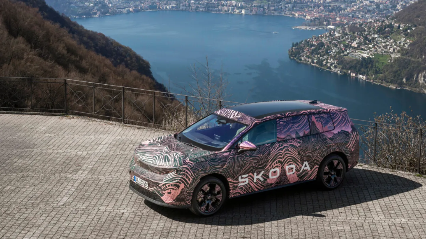 Skoda Peaq electric SUV prototype parked near a lake