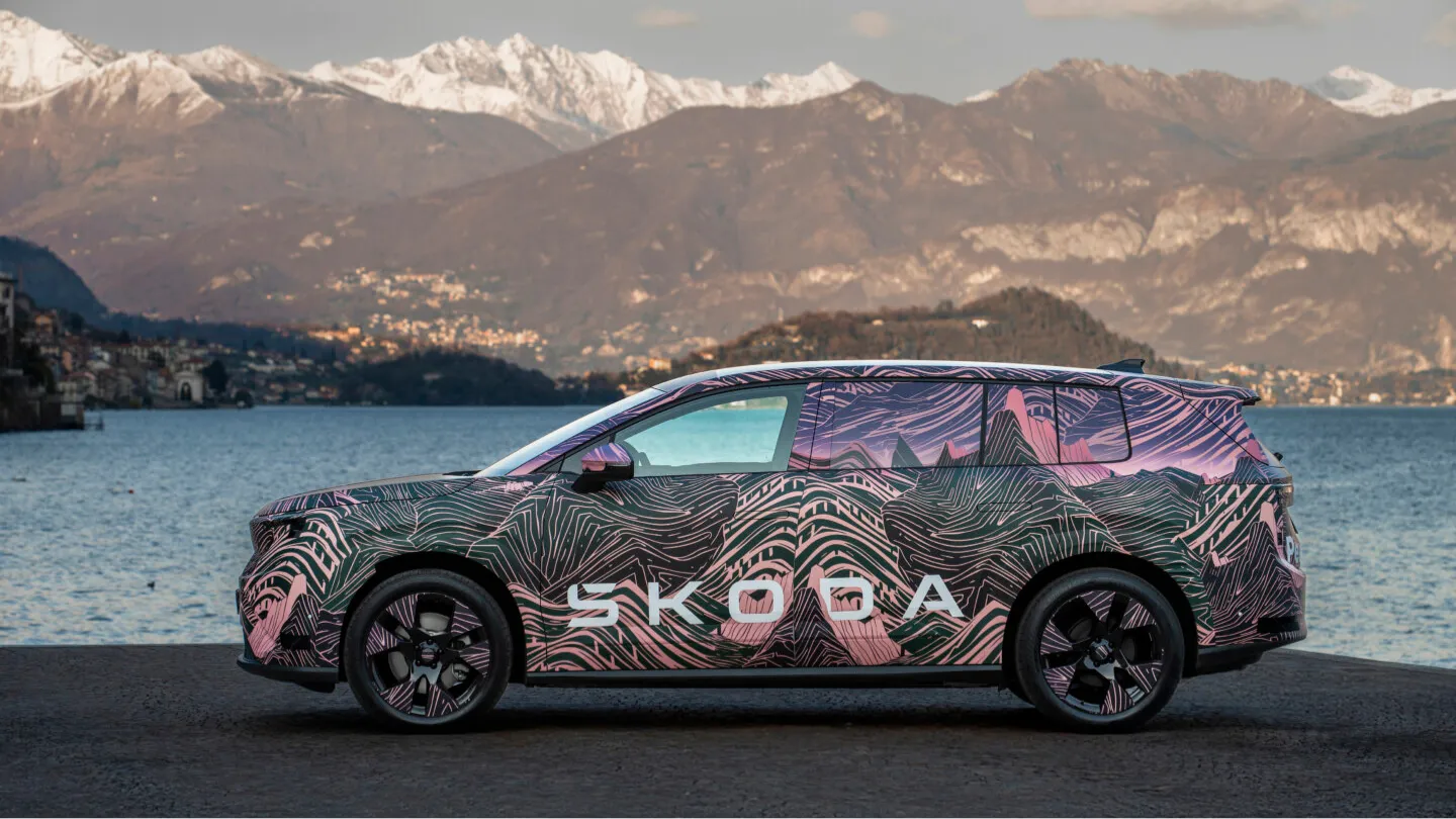 Skoda Peaq electric SUV prototype side view by a lake
