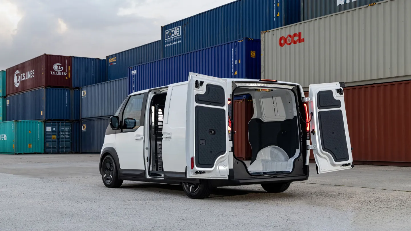 Kia PV5 Cargo parked in a shipping port opened