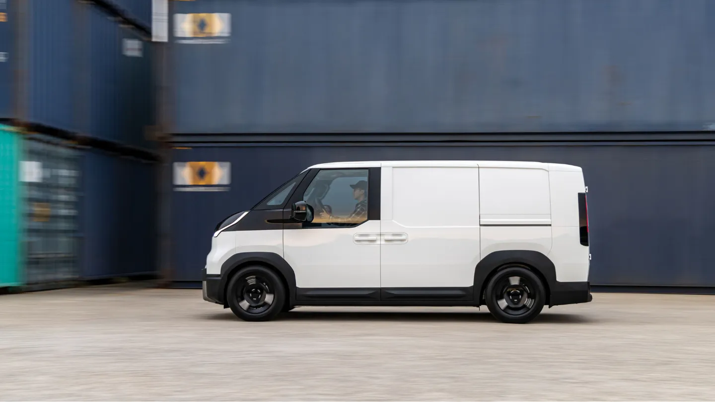 Kia PV5 Cargo side view with the shipping containers