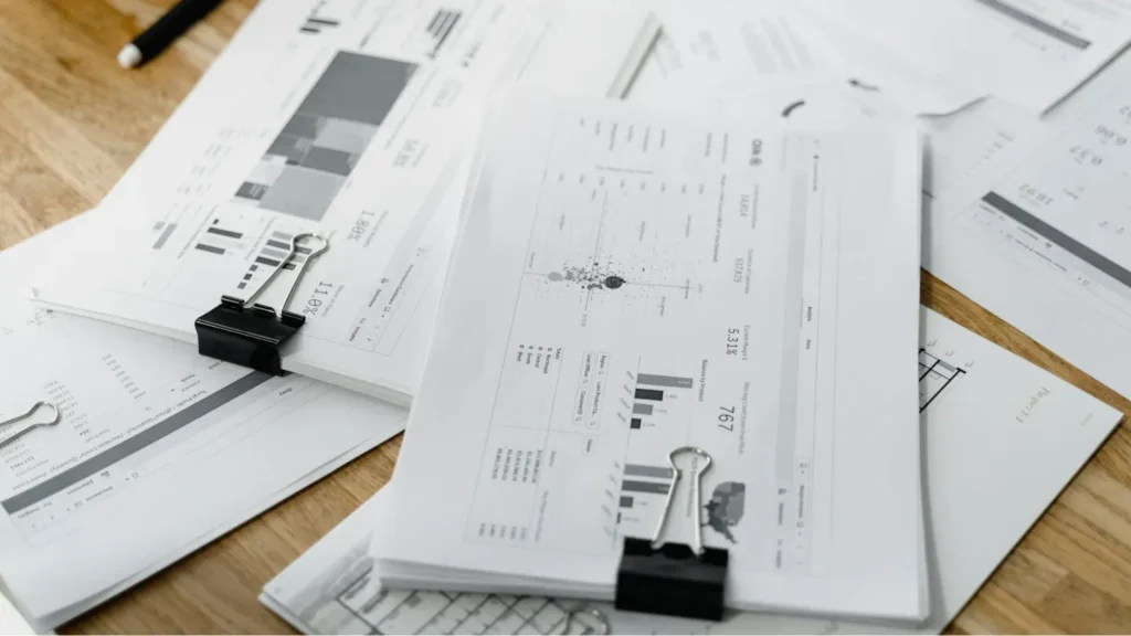 stacked financial reports on a table