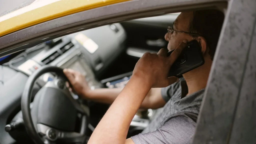 a person calling on the phone in a car
