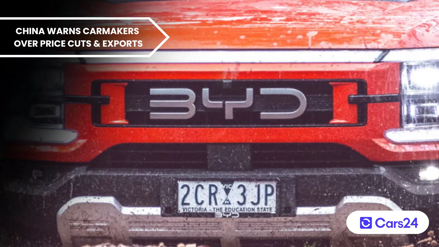 China warns carmakers over price cuts and exports