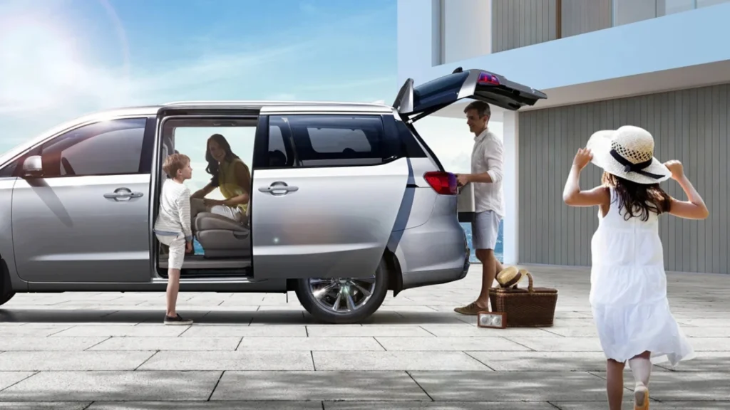 a family in a Kia Carnival MPV