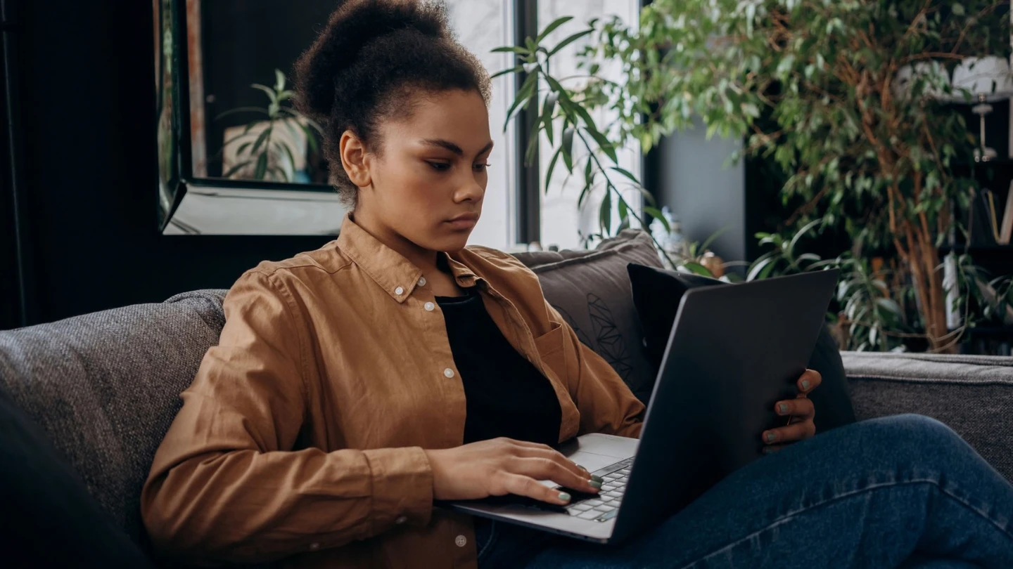 a woman researching something on her laptop
